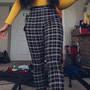 Black pants with yellow and white stripes
